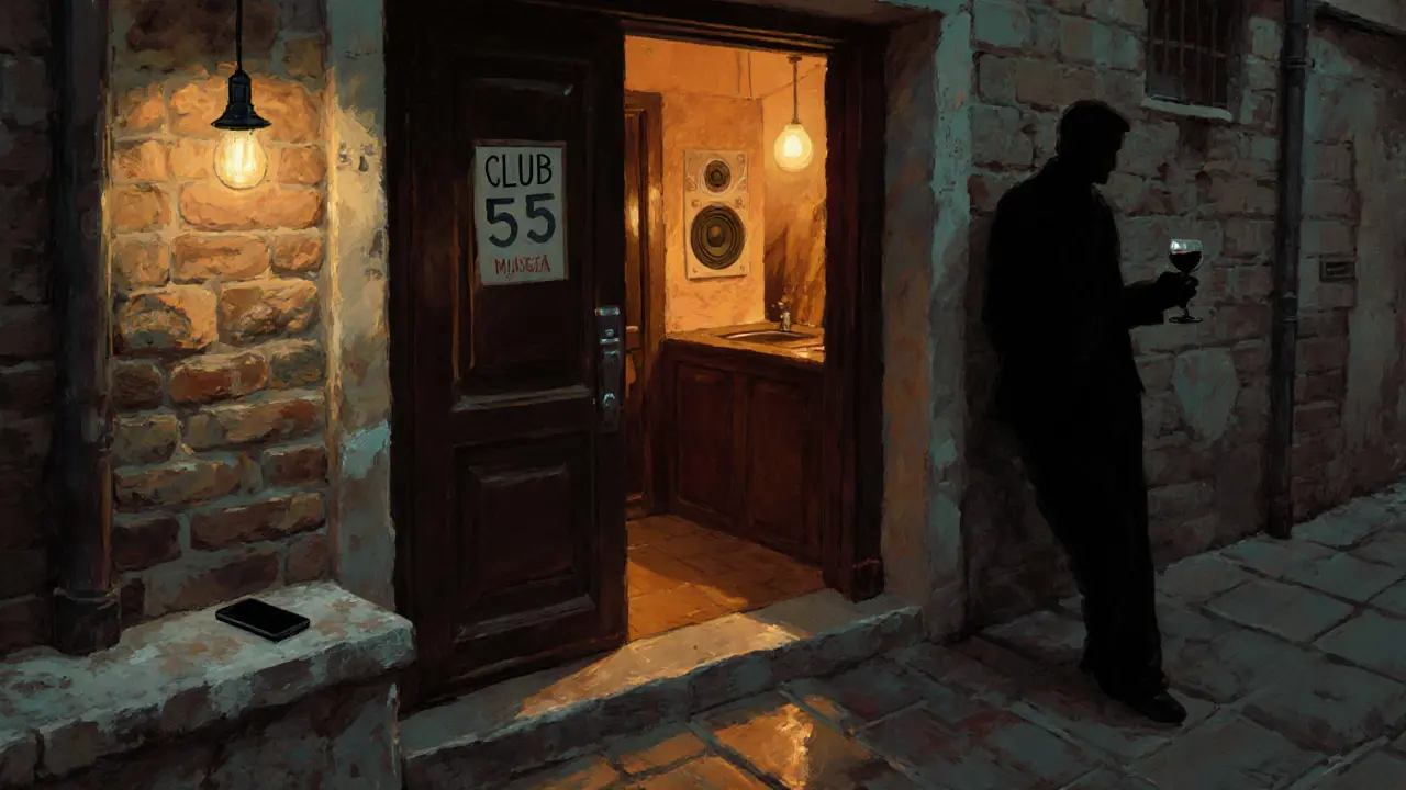 A hidden door to Club 55 glows faintly in a quiet alley behind Monaco’s marina.