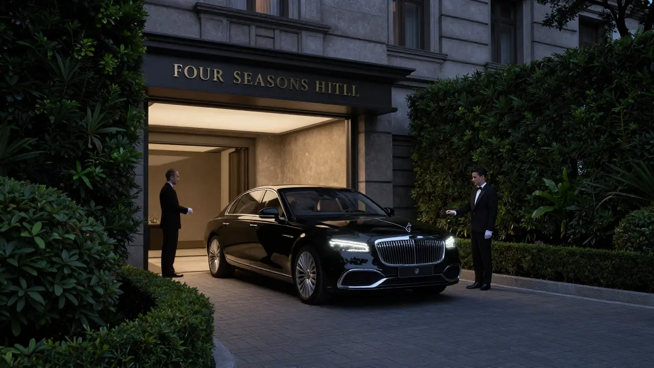 A private car arrives at the secluded entrance of Four Seasons Hotel Milano under moonlight, with no signs or crowds, exuding discretion.