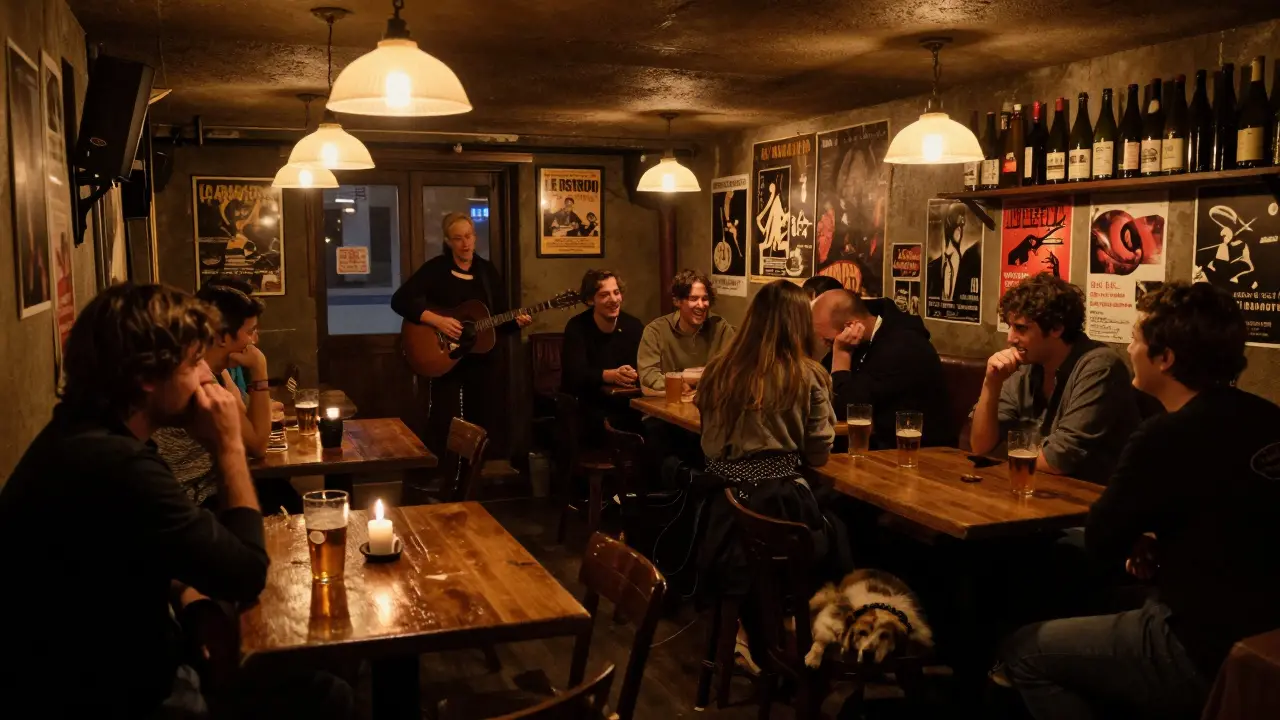 Locals laughing in a dim basement bar with a guitarist and sleeping dog
